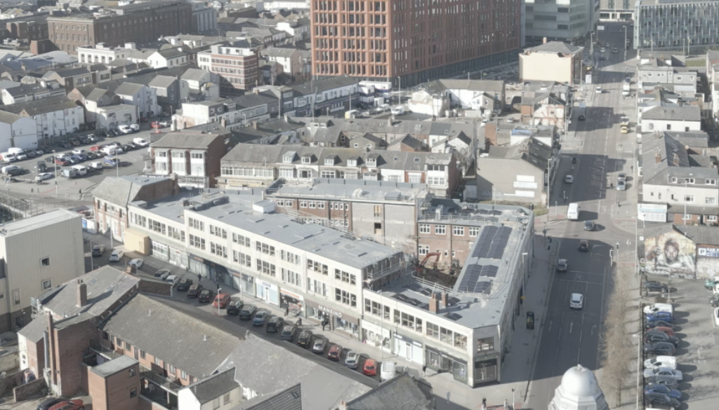 An aerial photograph of The Robinson with offices behind it