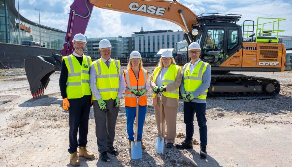A group of people standing on a building site