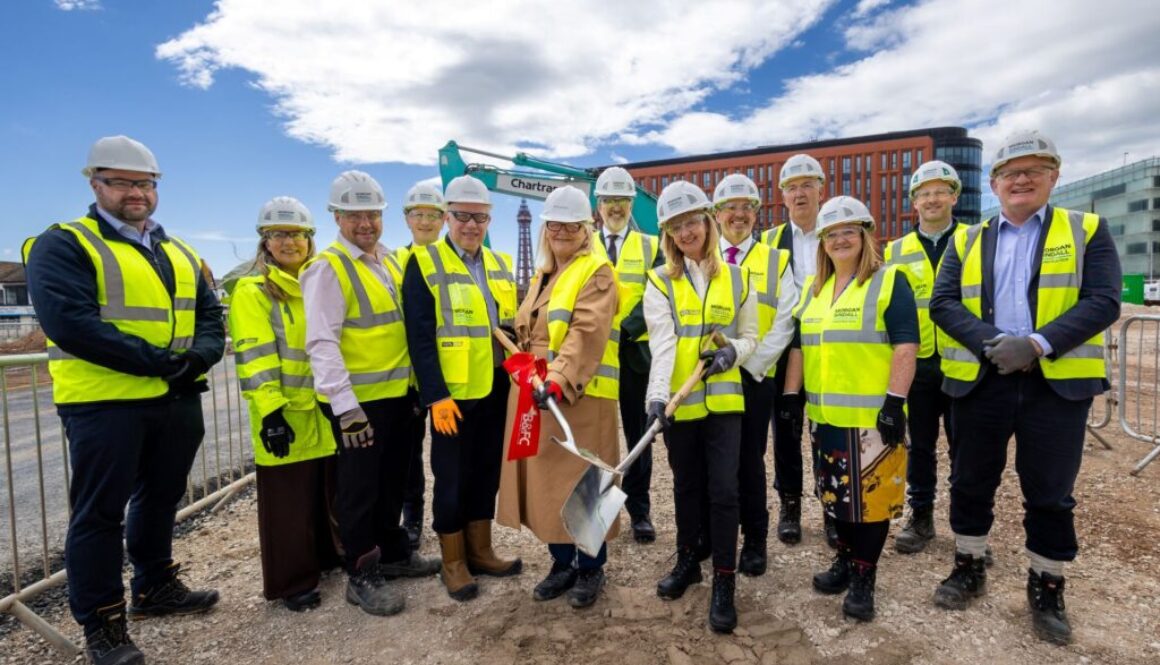 A group of people standing on a building site