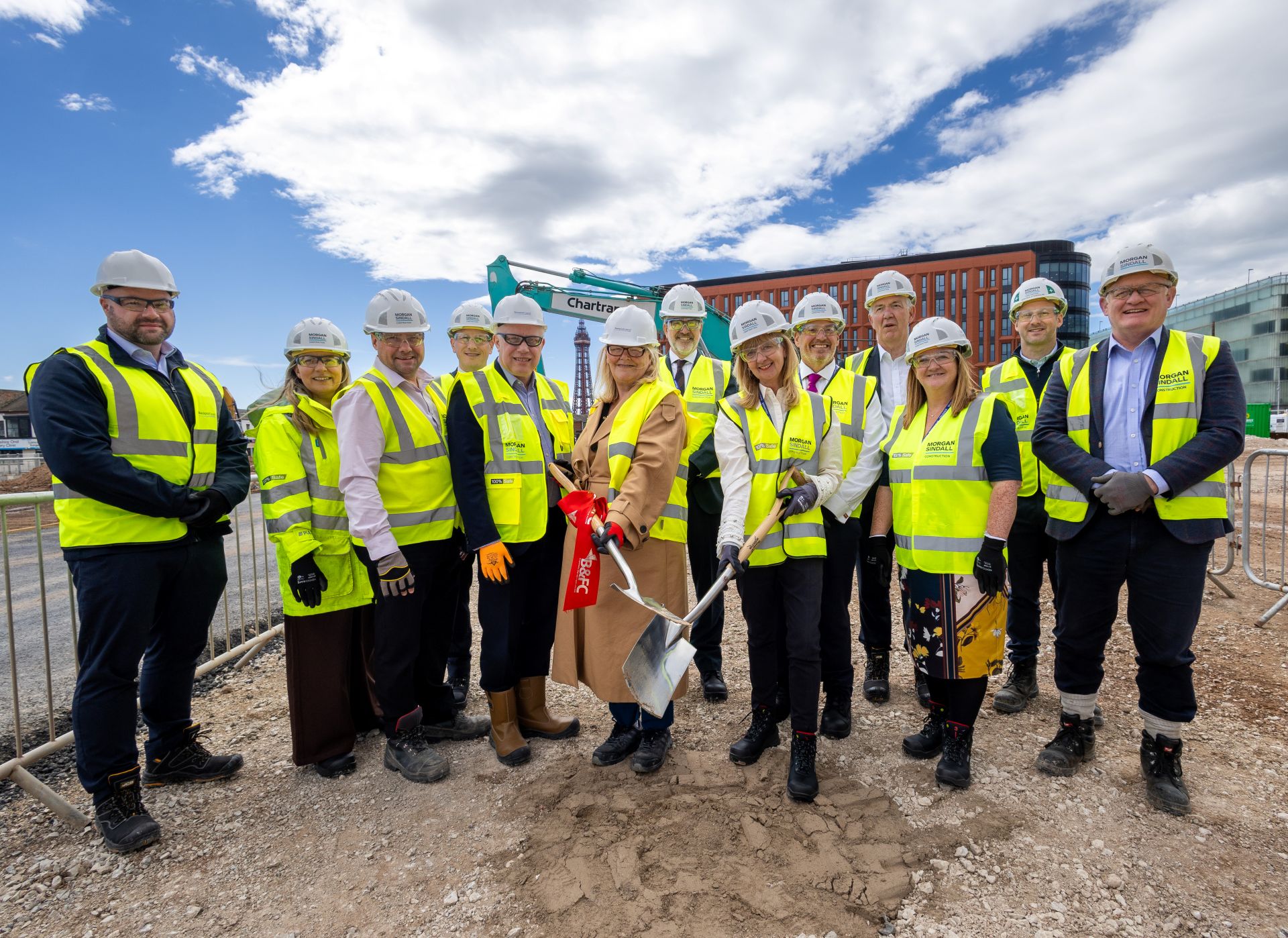 A group of people standing on a building site